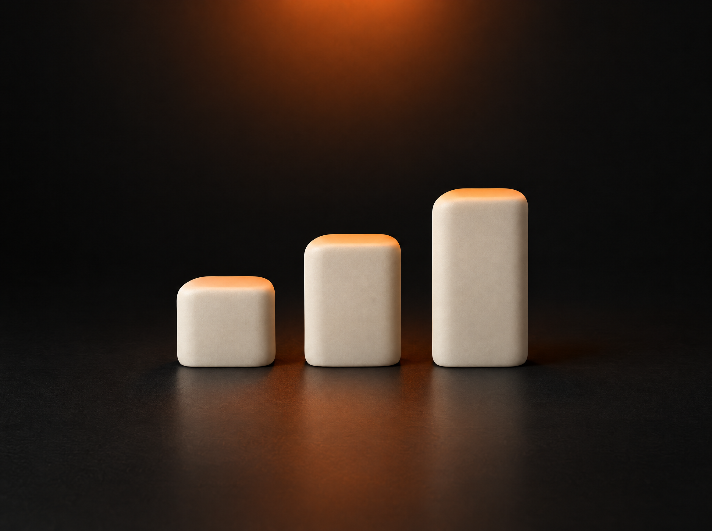 Three progressive steps on a dark desk, lit with a warm orange accent